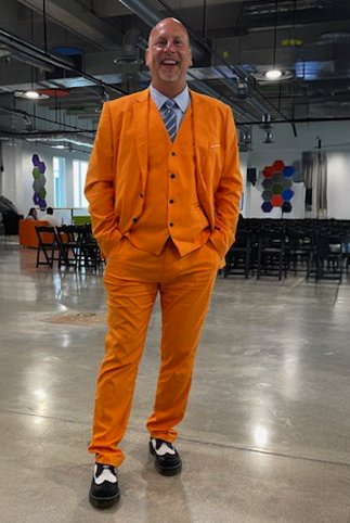 Timothy Cormier in a bright orange suit