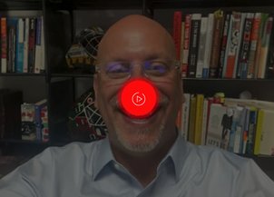 Timothy Cormier wearing a red nose on a video call